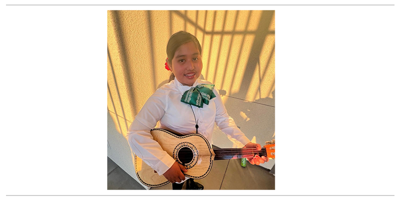 Student from Anaheim Elementary School District plays Mariachi music.