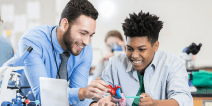 Teacher and student working on a project