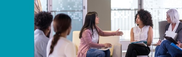 Group of seated women in a serious discussion