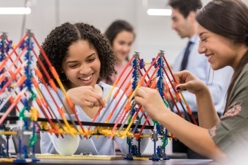 Two students working on a hands-on project together