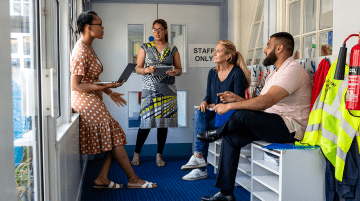 Group of teachers having a discussion in a school.