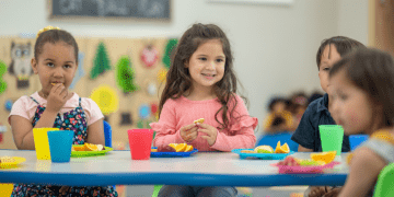 Children eating in a classroom