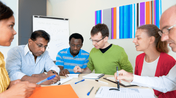 Group of adults having a discussion at a round table