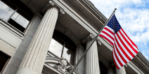 United States of America flag flying in front of a government building