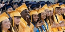 High School students clapping during graduation ceremony