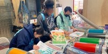 Students working collaboratively on a screen printing project.