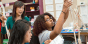 Students sculpt a clay model of the endocrine system.