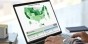 Interactive map displayed on laptop screen while someone is typing.