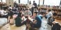 A group of students working collaboratively on an assignment in a library.