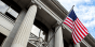 United States of America flag flying in front of a government building