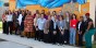 Group of educators in front of an outdoor mural.