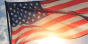 United States flag backlit by sun
